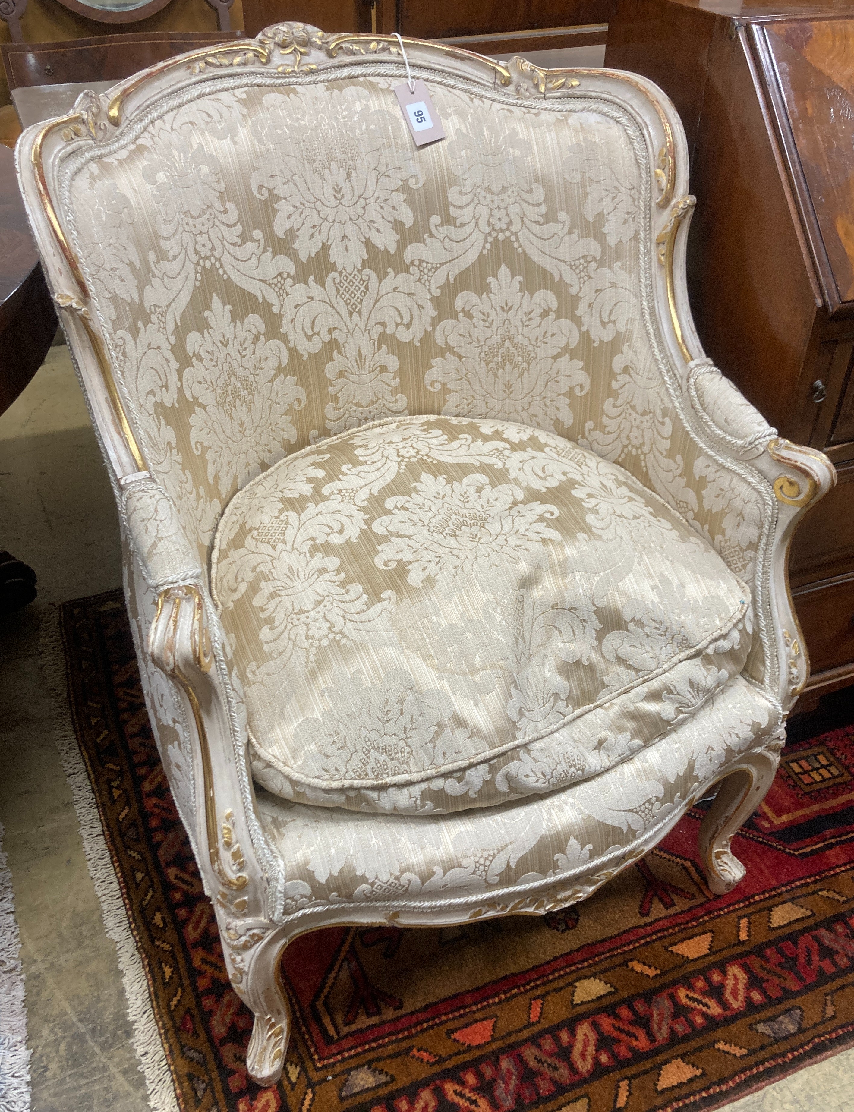 A Louis XVI Design cream painted parcel gilt armchair